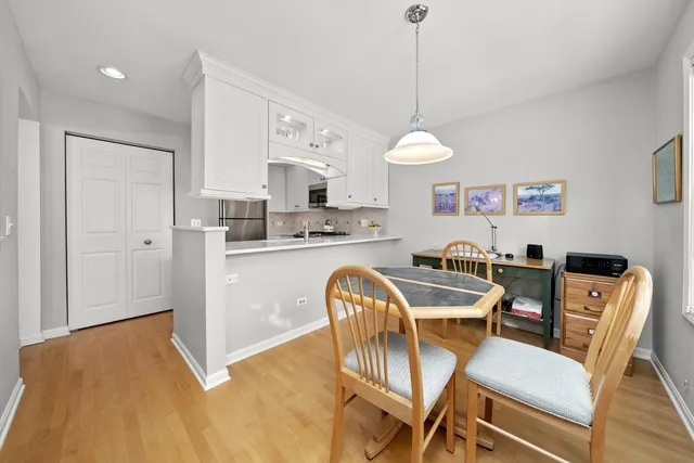 a dining room with furniture and window