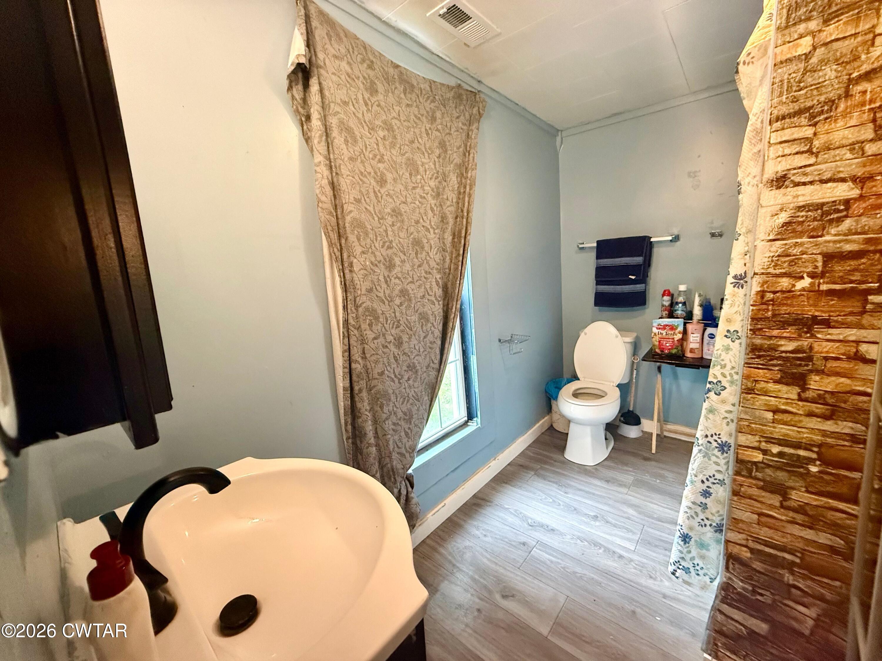 1935 Buster Collins Road Kenton, TN 38233 - Photo 7 of 18 a bathroom with a sink and a mirror