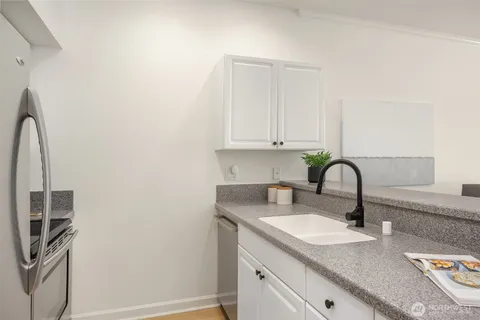 a kitchen with a sink and cabinets