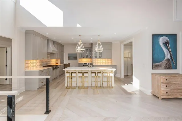 a living room with furniture a table and chairs