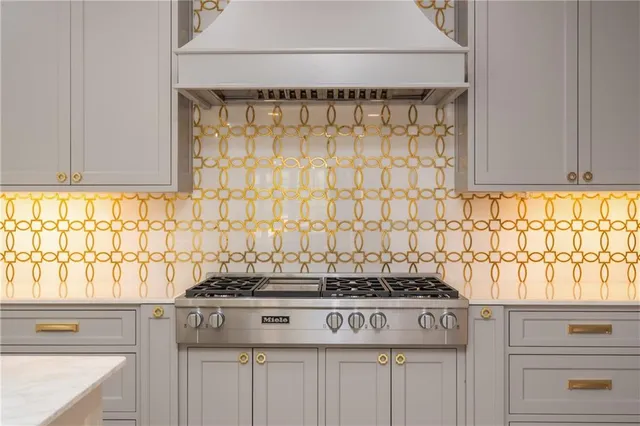 a bedroom with a bed and painting on the wall