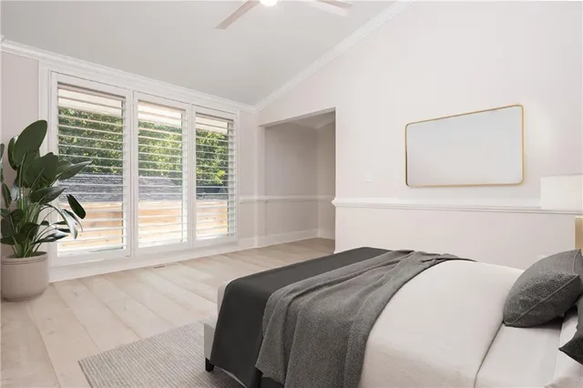 a living room with furniture a flat screen tv and a floor to ceiling window