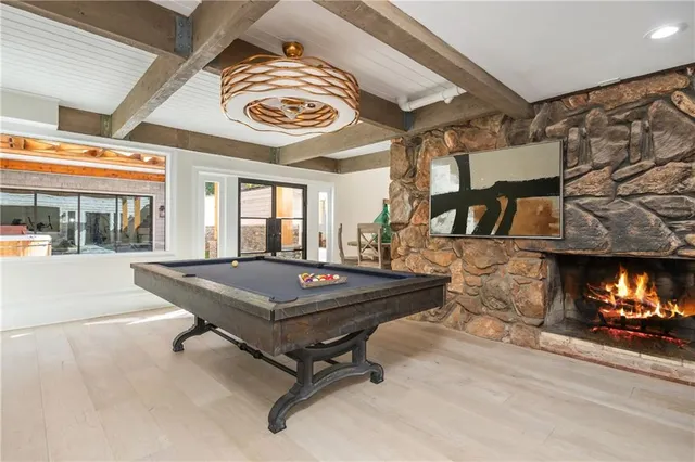 a view of a house with wooden fence