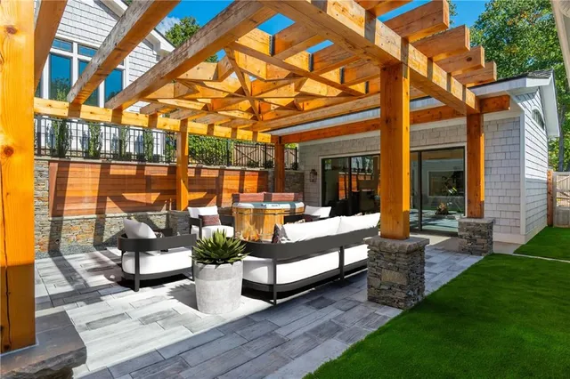 a view of a backyard with sitting area