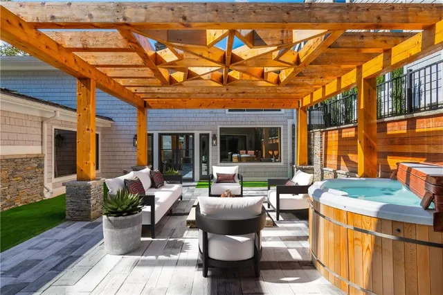 a view of a house with a yard and sitting area