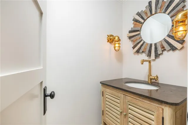 a view of a backyard with a table and chairs under an umbrella