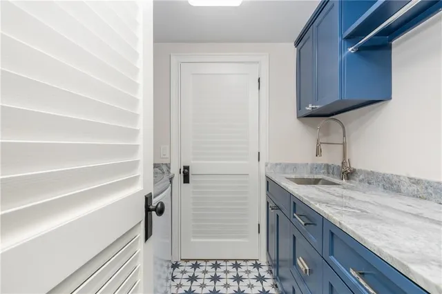 a view of a house with a yard and basketball court