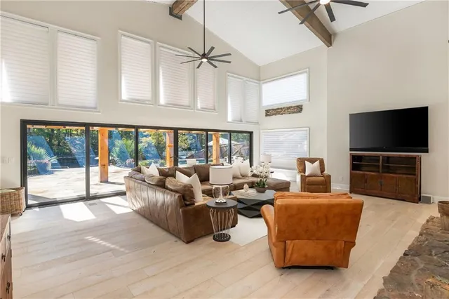 a view of a white house with a yard