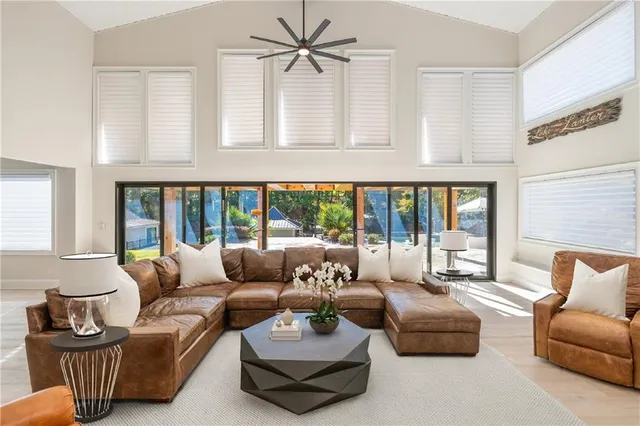 a kitchen with stainless steel appliances kitchen island granite countertop a sink and cabinets