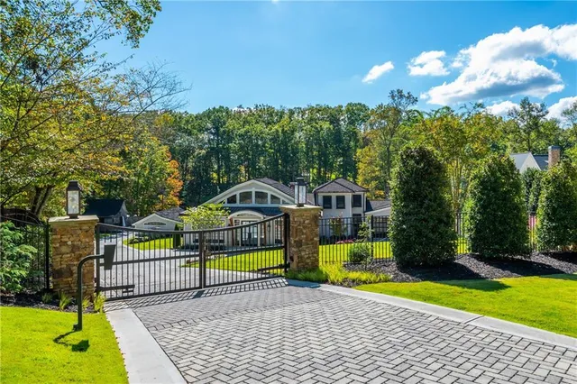 a view of a kitchen with granite countertop white cabinets and a white stove