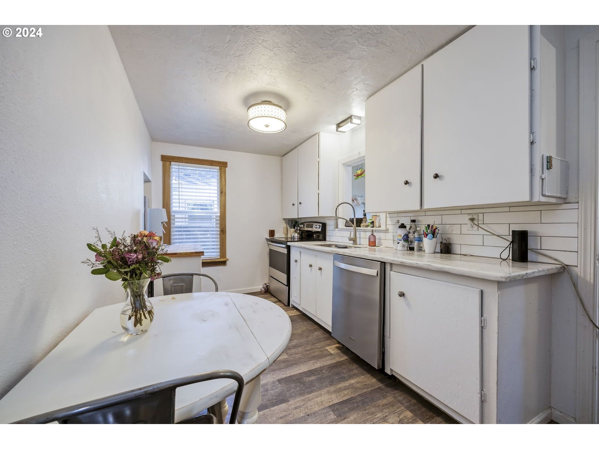 922 M Street Springfield, OR 97477 - Photo 8 of 18 a kitchen with sink and cabinets