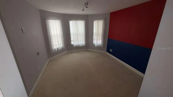 an empty room with windows
