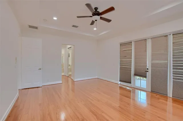 a bathroom with a tub a sink and mirror