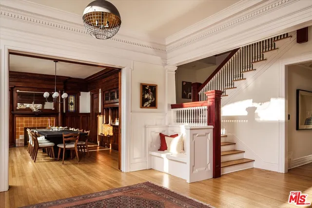 a view of dining room with furniture wooden floor and chandelier