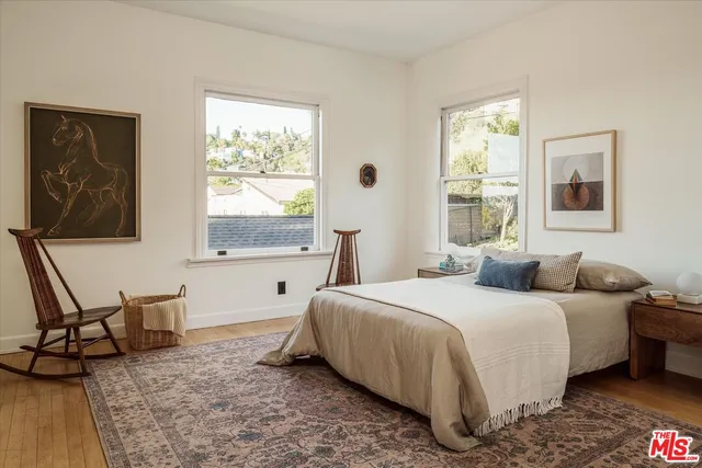 a view of a room with stairs and a chandelier fan