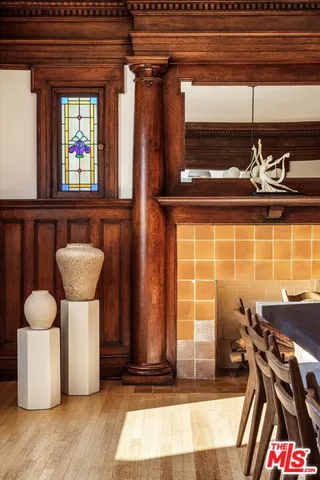 a view of a dining room with furniture and chandelier