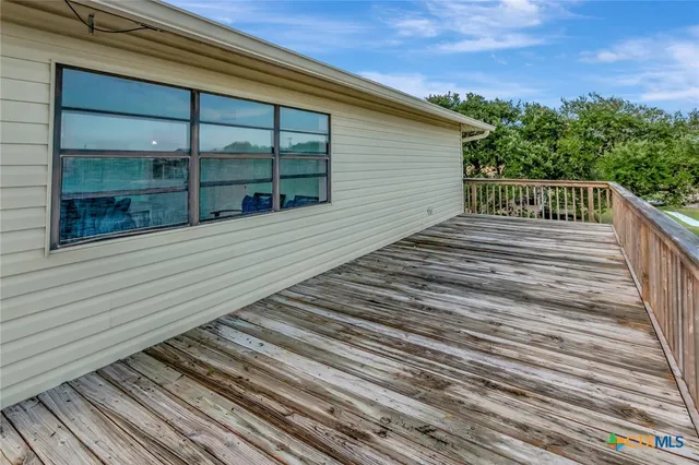 a view of wooden deck and city view