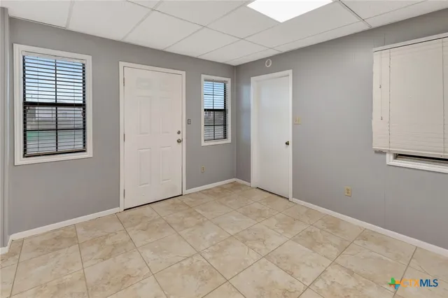 a view of an empty room with a window