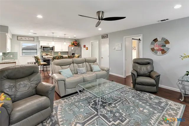 a living room with furniture and a rug