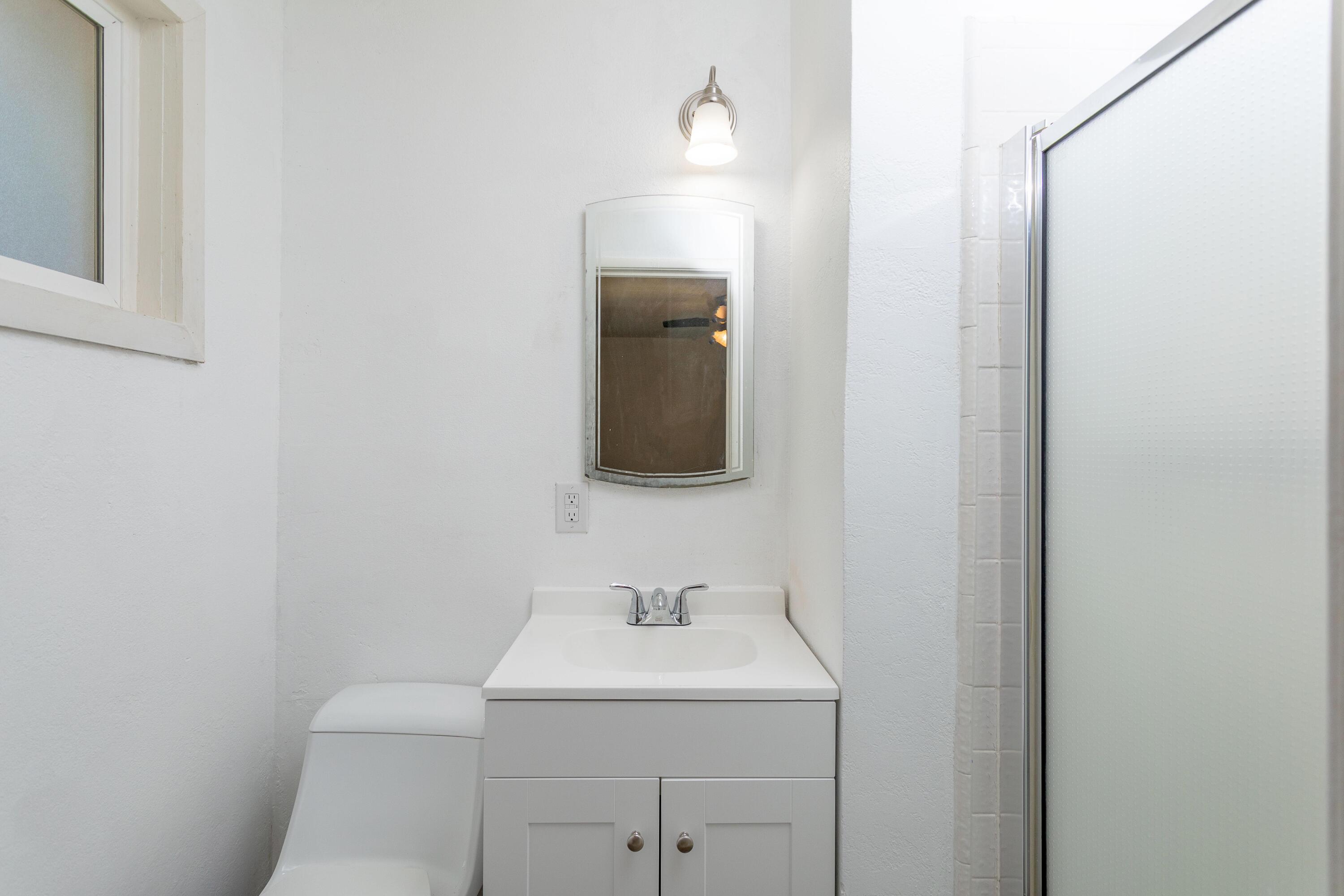 2943 Kenco Avenue Redding, CA 96002 - Photo 12 of 19 a bathroom with a sink and a mirror