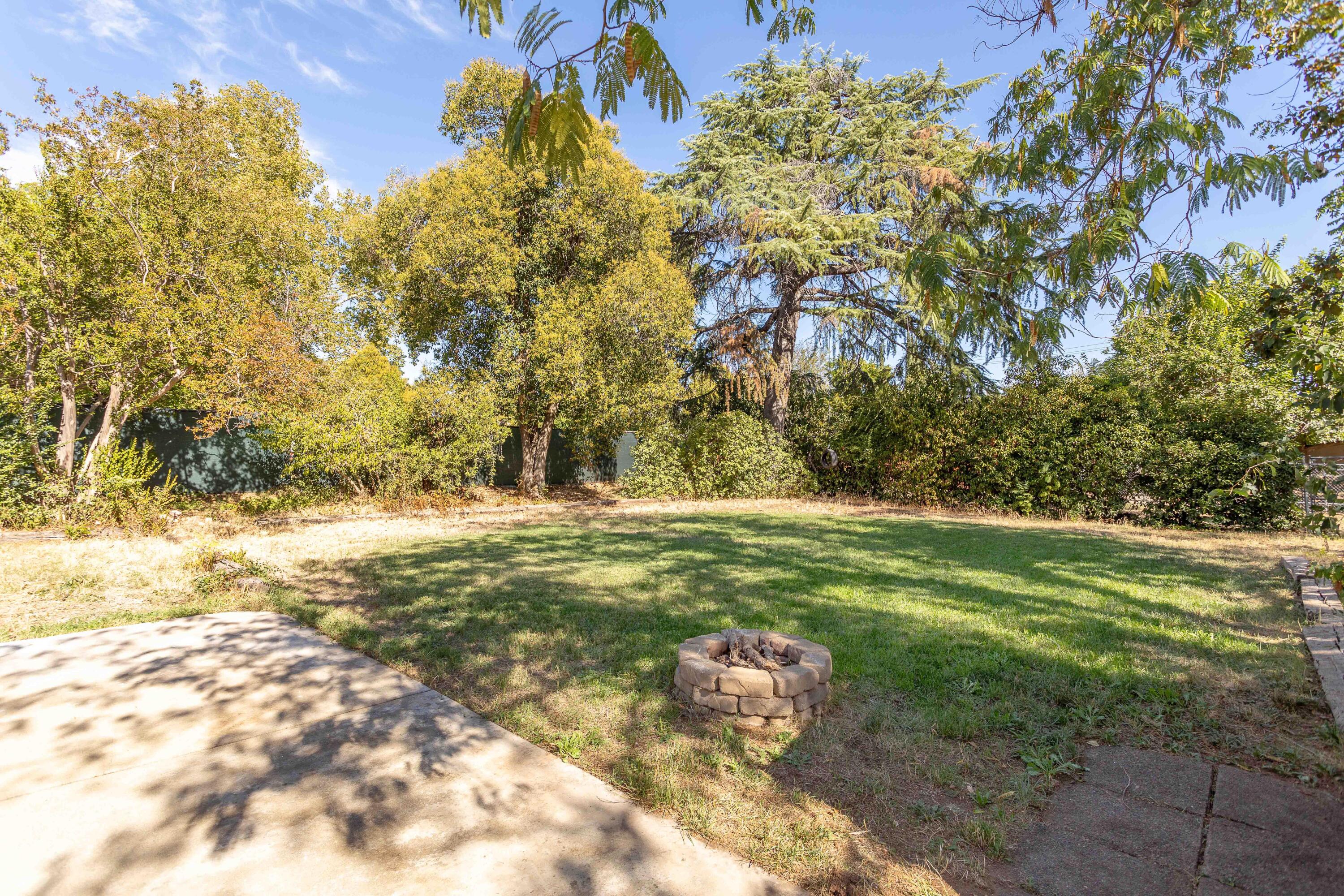 2943 Kenco Avenue Redding, CA 96002 - Photo 17 of 19 a view of a yard with an outdoor space