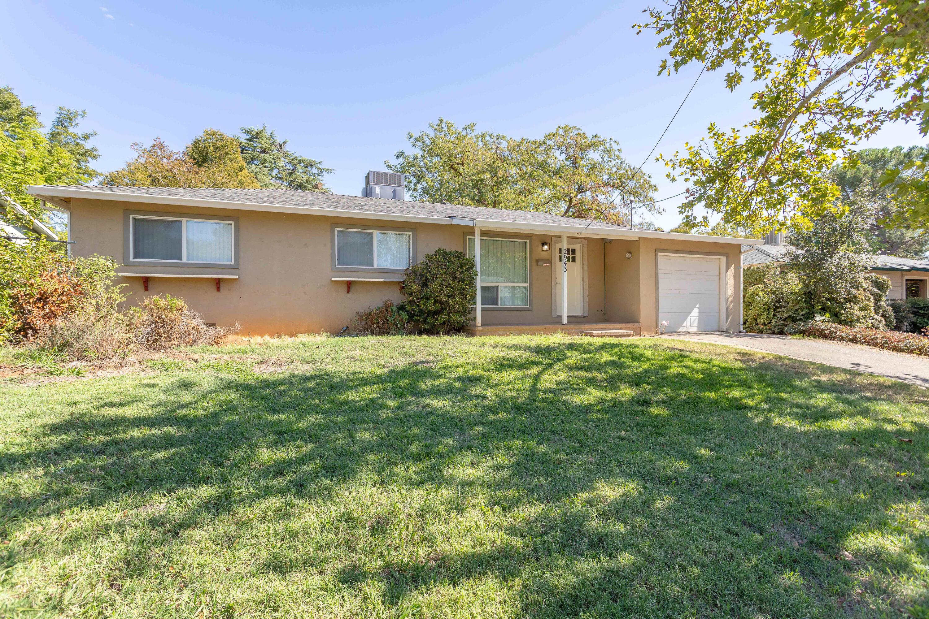2943 Kenco Avenue Redding, CA 96002 - Photo 19 of 19 a view of a house with a yard