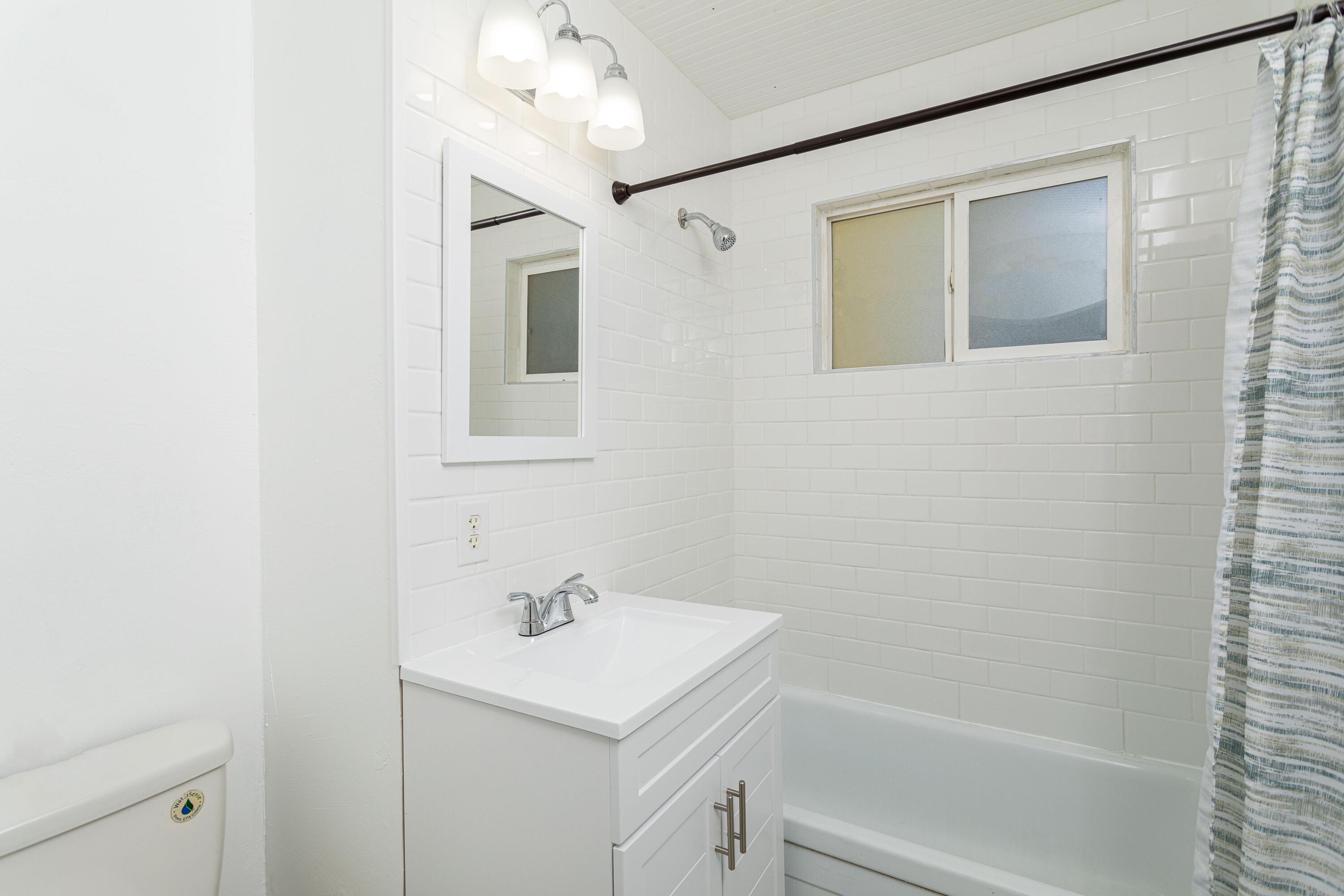2943 Kenco Avenue Redding, CA 96002 - Photo 7 of 19 a bathroom with a sink a toilet and shower