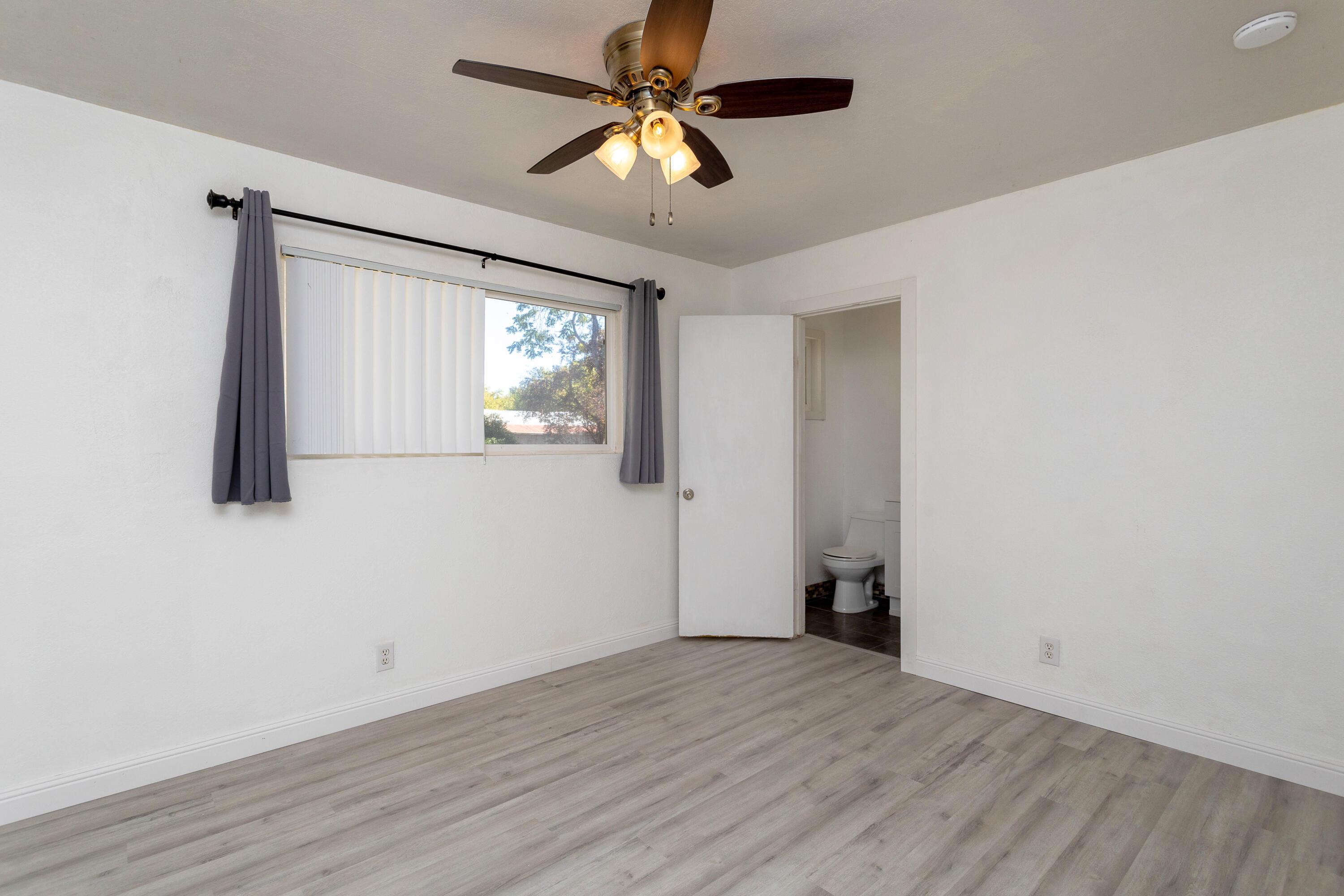 2943 Kenco Avenue Redding, CA 96002 - Photo 10 of 19 a view of empty room with wooden floor and fan