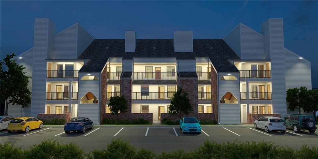 6108 Abrams Road, Unit 613 Dallas, TX 75231 - Photo 12 of 27 a car parked in front of a brick building