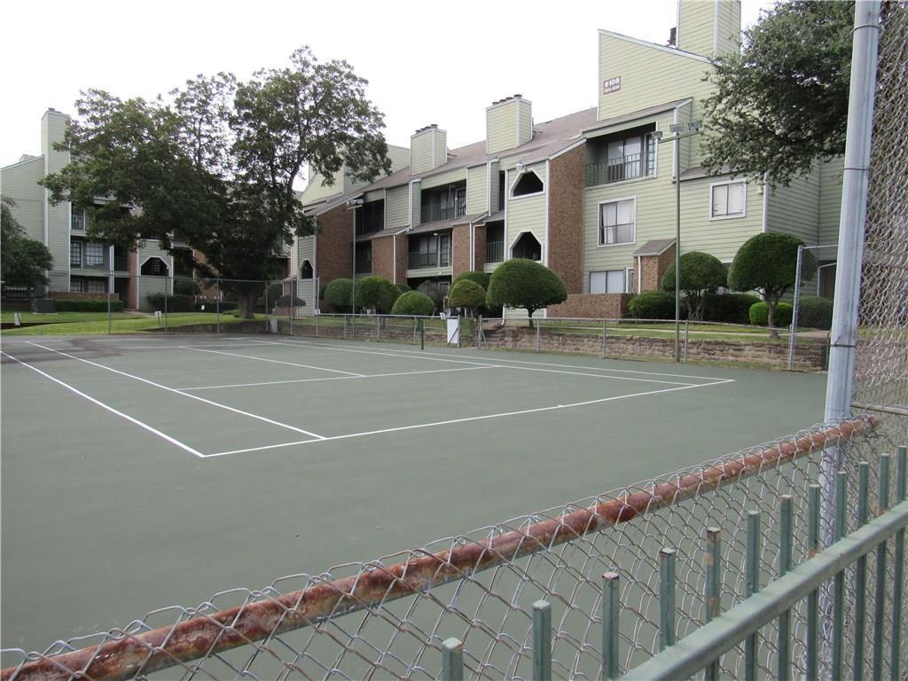 6108 Abrams Road, Unit 613 Dallas, TX 75231 - Photo 13 of 27 a view of a tennis court
