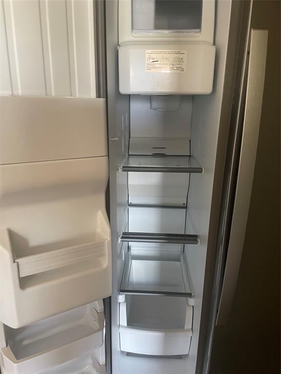 6108 Abrams Road, Unit 613 Dallas, TX 75231 - Photo 21 of 27 a refrigerator in a kitchen