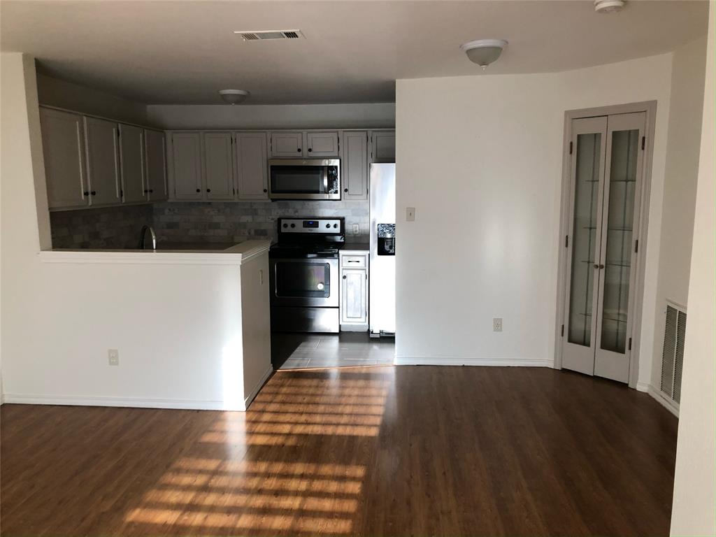 6108 Abrams Road, Unit 613 Dallas, TX 75231 - Photo 4 of 27 a view of a kitchen with electric appliances