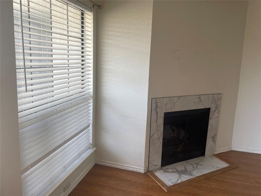 6108 Abrams Road, Unit 613 Dallas, TX 75231 - Photo 7 of 27 a view of a livingroom with a staircase