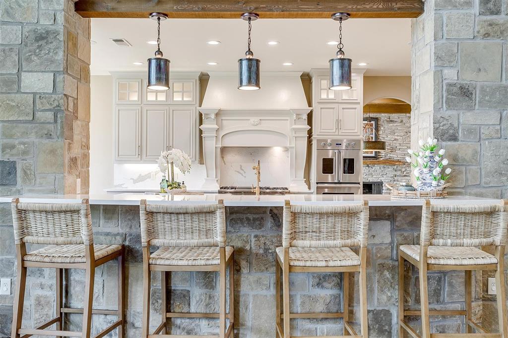 9930 Boat Club Road Fort Worth, TX 76179 - Photo 12 of 40 a view of a kitchen with stainless steel appliances granite countertop a stove and cabinets