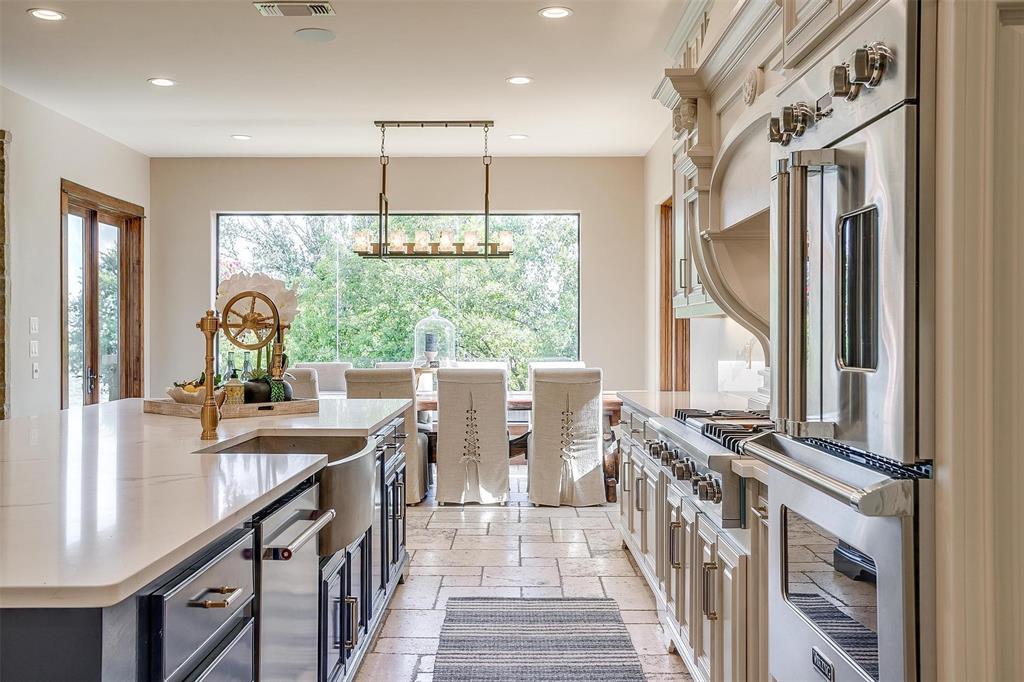 9930 Boat Club Road Fort Worth, TX 76179 - Photo 13 of 40 a view of a kitchen with kitchen island granite countertop a large window