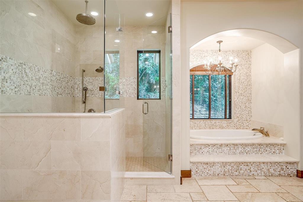 9930 Boat Club Road Fort Worth, TX 76179 - Photo 18 of 40 a bathroom with a bathtub and a shower