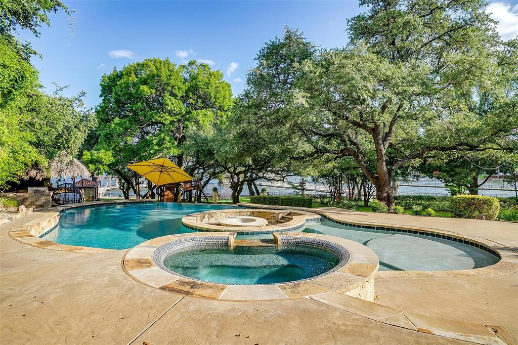 9930 Boat Club Road Fort Worth, TX 76179 - Photo 29 of 40 a view of a swimming pool with a yard
