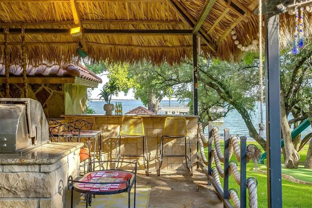 a living room with a fireplace and a flat screen tv