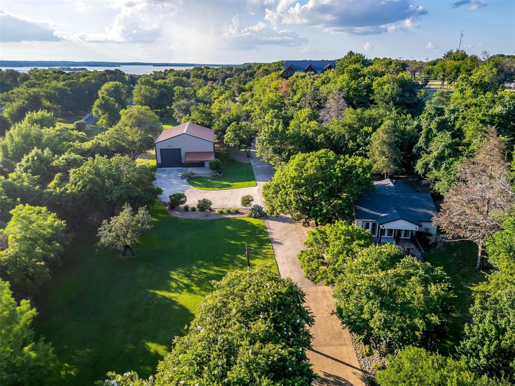 9930 Boat Club Road Fort Worth, TX 76179 - Photo 38 of 40 a view of a garden with a building in the background