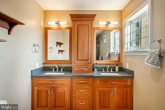 a bathroom with a glass shower door