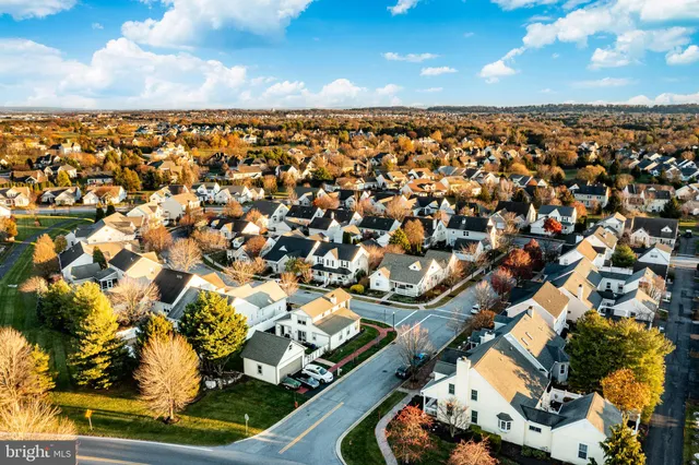 an aerial view of a residential apartment building with a yard