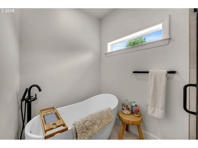 a bathroom with a toilet sink and shower