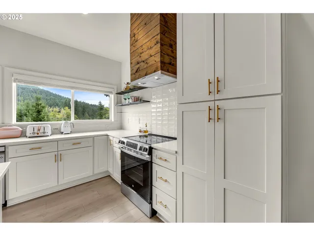 a kitchen with appliances cabinets and a sink