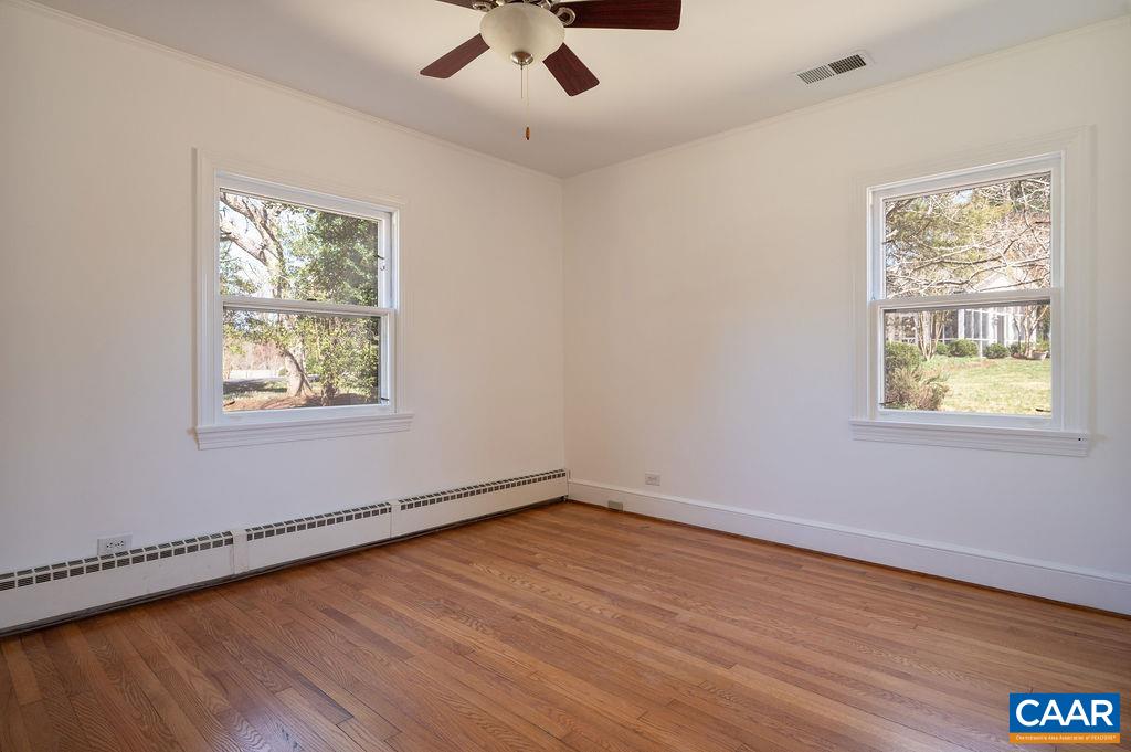 15 Orchard Road Charlottesville, VA 22903 - Photo 24 of 38 a view of an empty room with wooden floor and a window