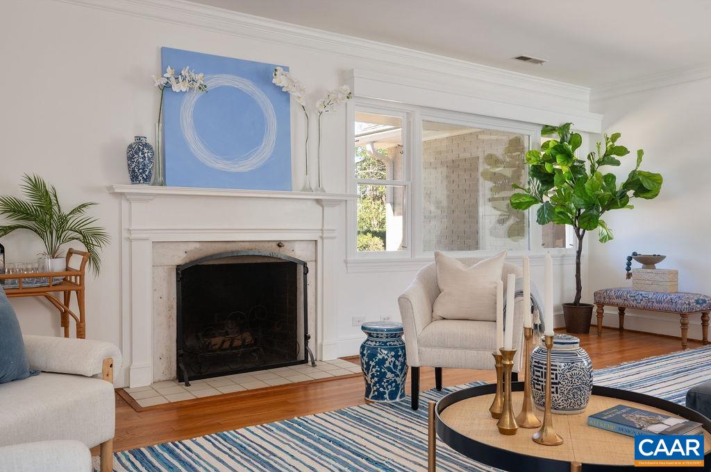 15 Orchard Road Charlottesville, VA 22903 - Photo 9 of 38 a living room with furniture a potted plant and a fireplace