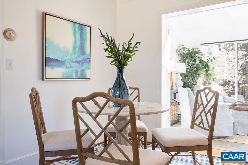 15 Orchard Road Charlottesville, VA 22903 - Photo 10 of 38 a view of a dining room with furniture wooden floor and a potted plant