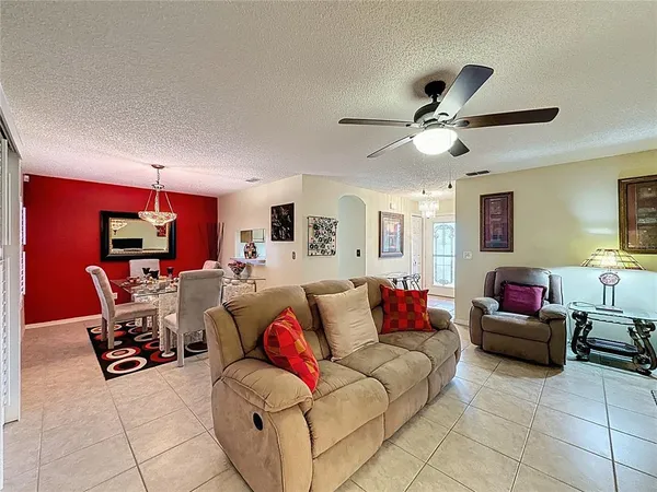 a living room with granite countertop furniture and a stove