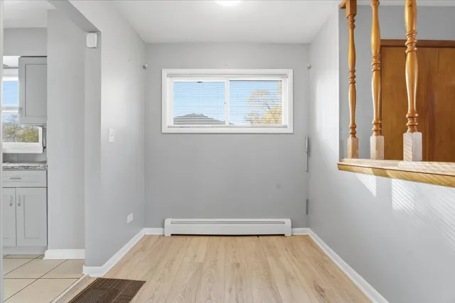 a white refrigerator freezer sitting inside of a kitchen with stainless steel appliances granite countertop a refrigerator sink and cabinets