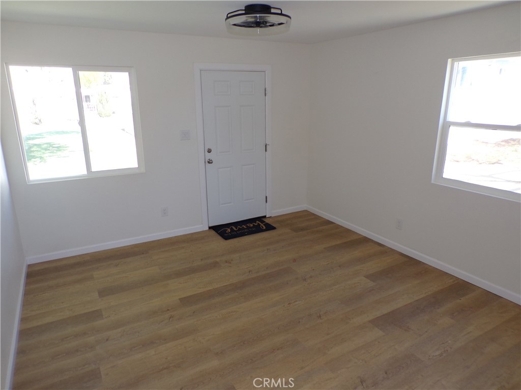 34759 Avenue B Court, Unit 3 Yucaipa, CA 92399 - Photo 2 of 6 an empty room with a window
