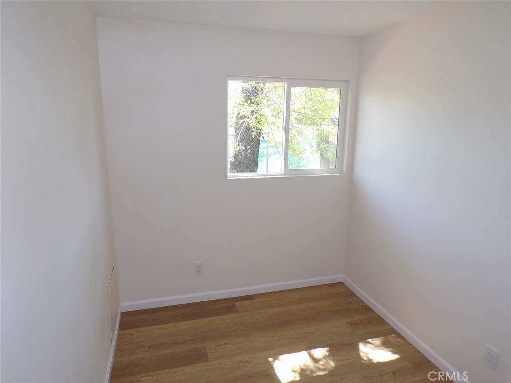 34759 Avenue B Court, Unit 3 Yucaipa, CA 92399 - Photo 6 of 6 an empty room with a window